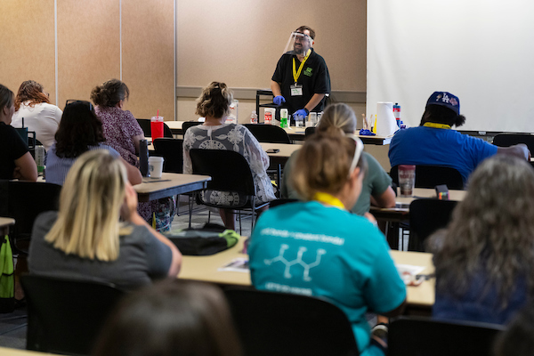 Chemistry Professor doing presentation at STEM Conference